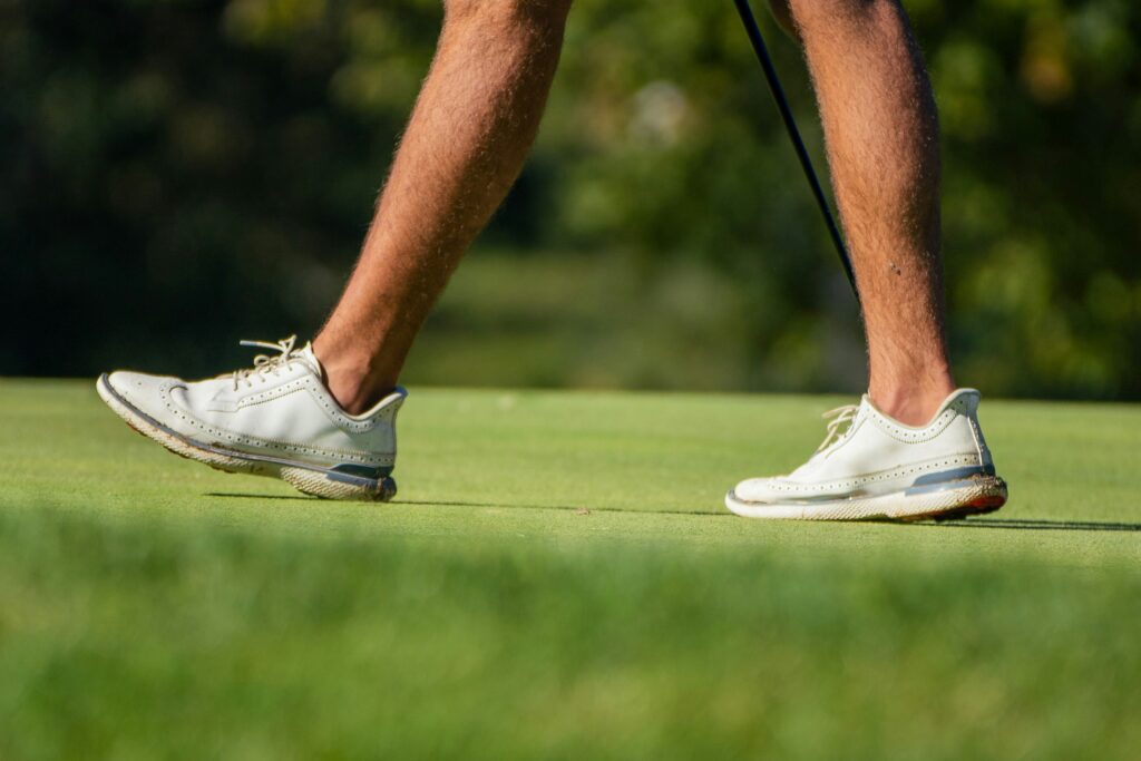 High performance moisture wicking golf polo and spikeless shoes for the practical comfort apparel guide.